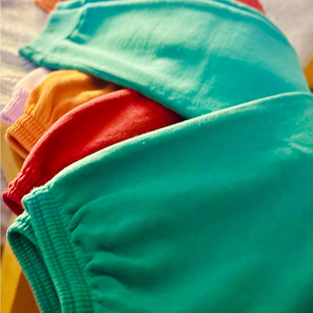 4 Hanes Women's Track Pants in Green, Red, Orange, and Pink
